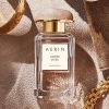 Luxury Amber Musk by AERIN perfume displayed in a clear glass bottle with minimalist design