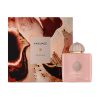 Amouage Guidance Eau de Parfum bottle with matching artistic packaging displayed beside abstract pink and brown watercolor-inspired artwork