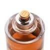 Close-up of Byredo Cuir Sellier Extrait de Parfum atomizer and gold spray nozzle