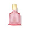 Front-facing bottle of Creed Eladaria Eau de Parfum with translucent pink glass and gold cap isolated on a clean light background.