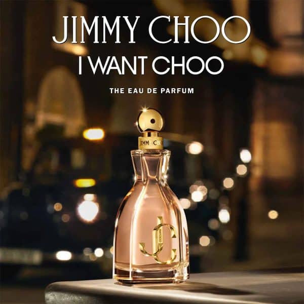 I Want Choo Eau de Parfum by Jimmy Choo showcased in a glamorous nighttime city setting with glowing lights and luxury evening atmosphere.