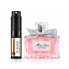 Elegant Miss Dior perfume bottle with pink liquid and silver bow.