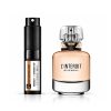 Givenchy L'Interdit perfume bottle and rollerball on white background.