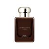 Jo Malone Myrrh & Tonka Cologne Intense perfume bottle with silver cap.