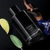 Elegant black Armani Code Parfum bottle with citrus and floral accents.